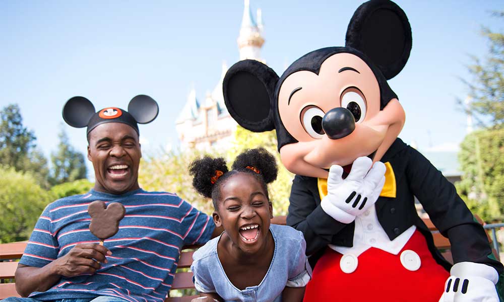 Family Enjoying Ice Cream With Cast Member In Mickey Mouse Costume