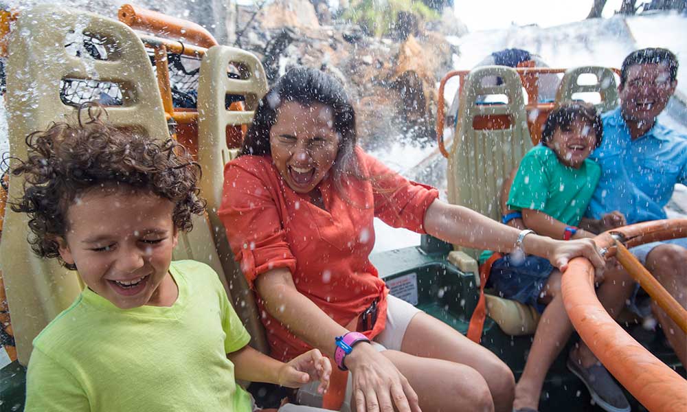 Family Riding Kali River Rapids At Disney's Animal Kingdom