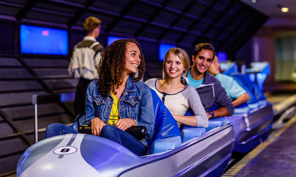 Teens Riding Space Mountain At Disney's Magic Kingdom©