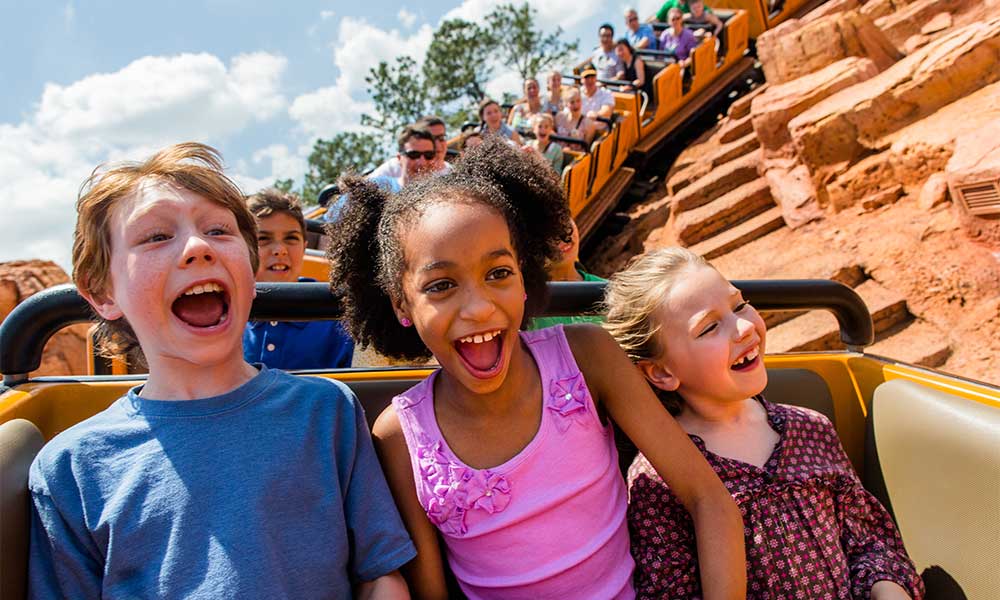 Kids Riding Big Thunder Mountain Railroad At Disney's Magic Kingdom©